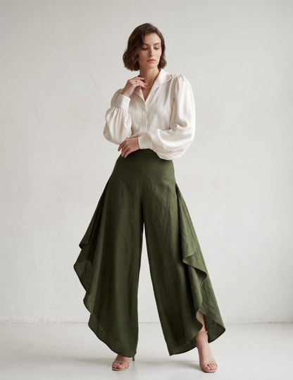 Woman modeling the fi nished Clara split leg palazzo trousers in olive green linen. An elegant and easy sewing pattern for wide leg pants.