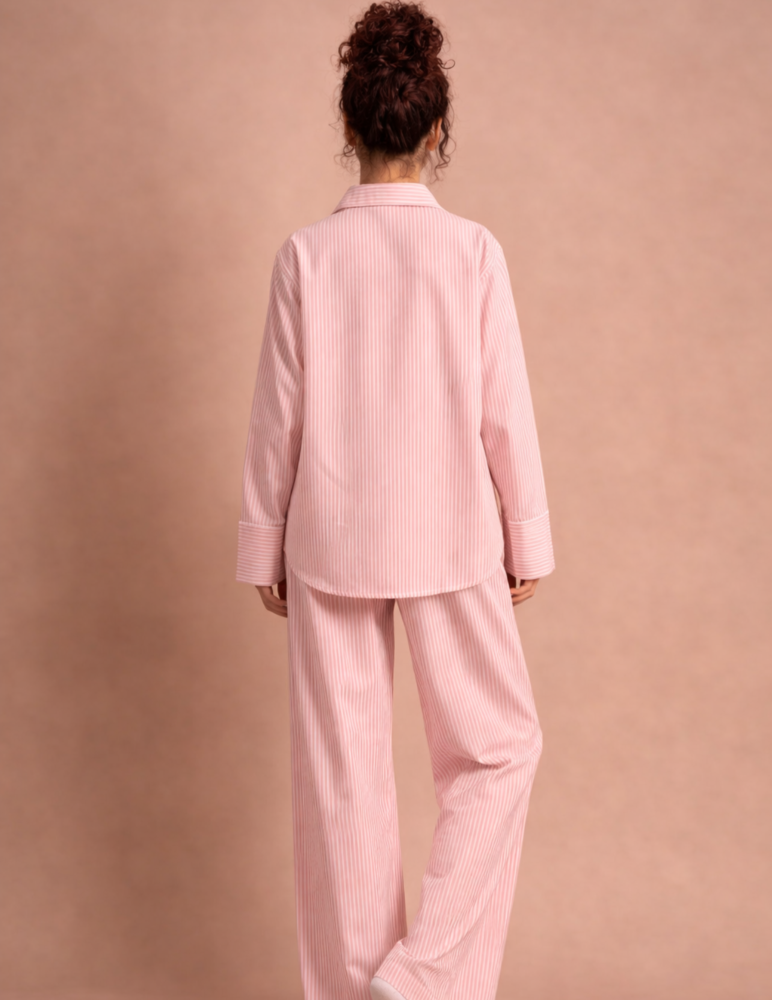 Rosie Set PDF sewing pattern shown in a relaxed pink striped shirt and wide-leg pants