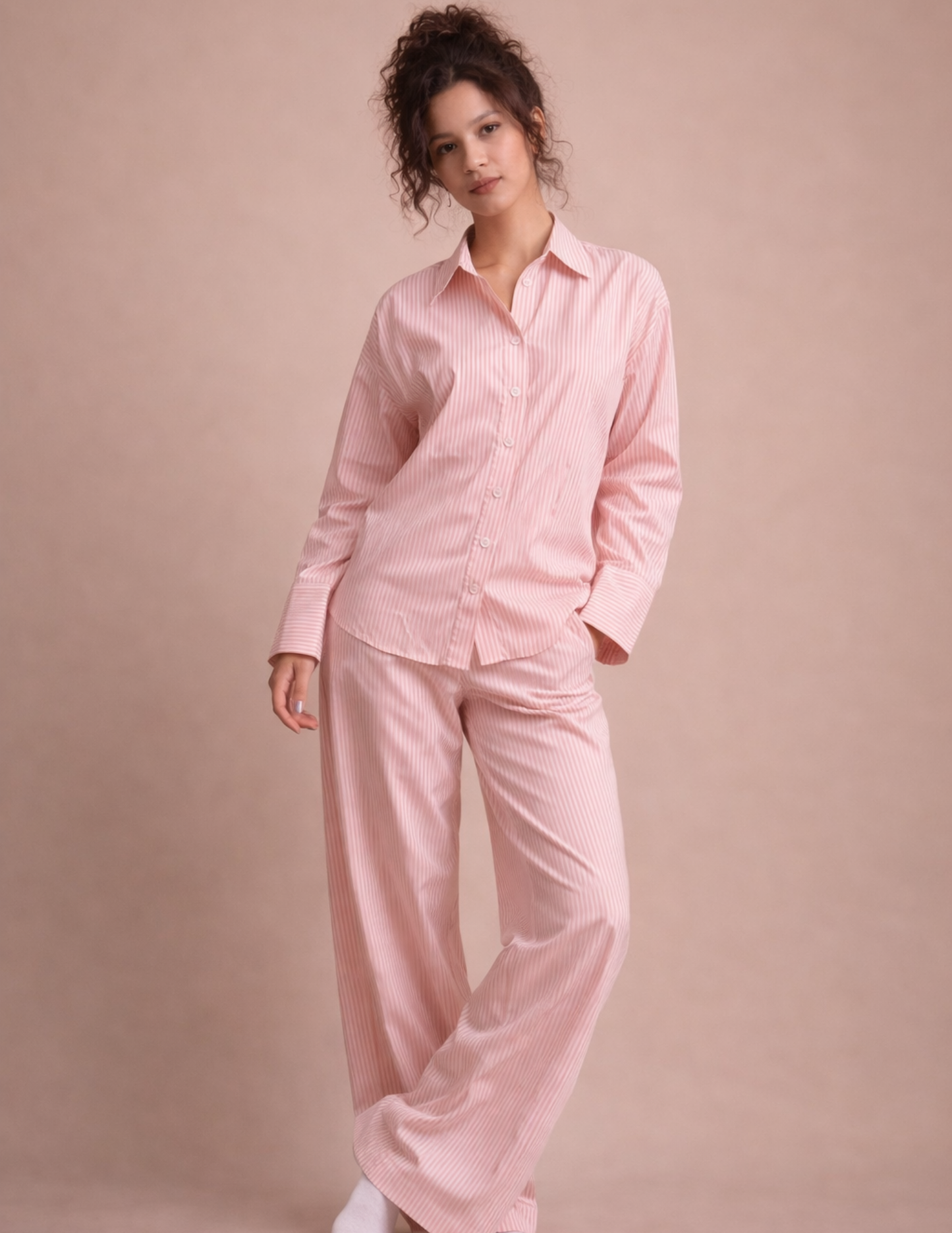Rosie Set sewing pattern shown as a pink striped pajama set with button-up shirt and wide-leg pants