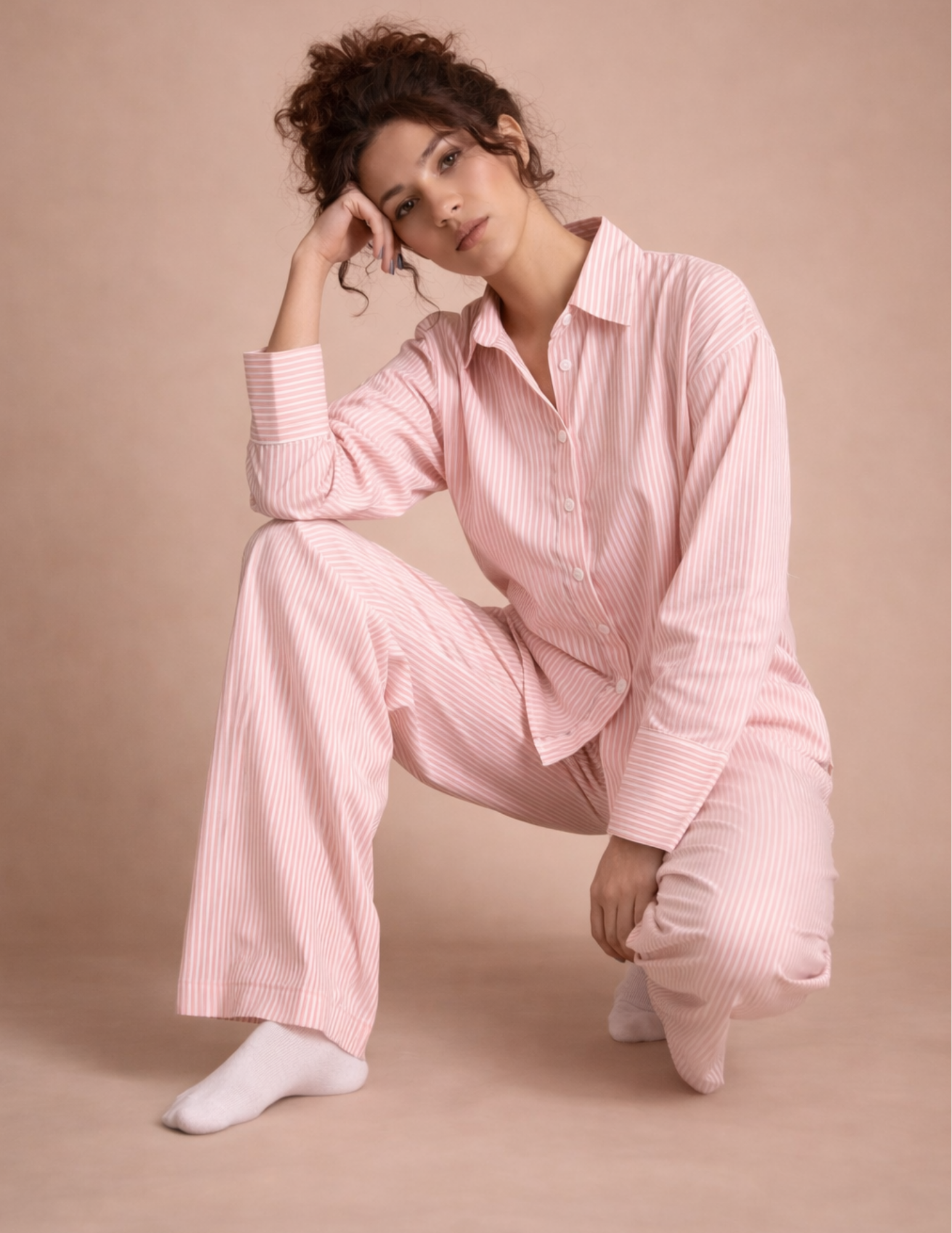 Rosie Set sewing pattern modeled in pink striped fabric with button-up shirt and wide-leg pants