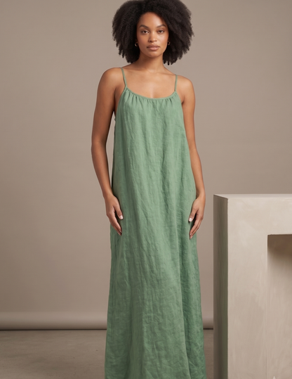 Front view of the 
Amazonie linen maxi 
dress featuring a 
relaxed A-line 
silhouette, gathered 
neckline and elegant 
summer design.