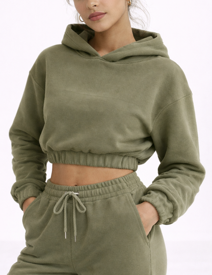 Close-up of the EBONY cropped hoodie showing the hood, dropped shoulders, elastic waistband and relaxed fit.