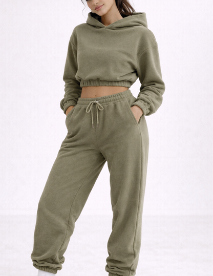 Close-up of the EBONY cropped hoodie showing the relaxed fit, elastic hem and matching jogger pants.