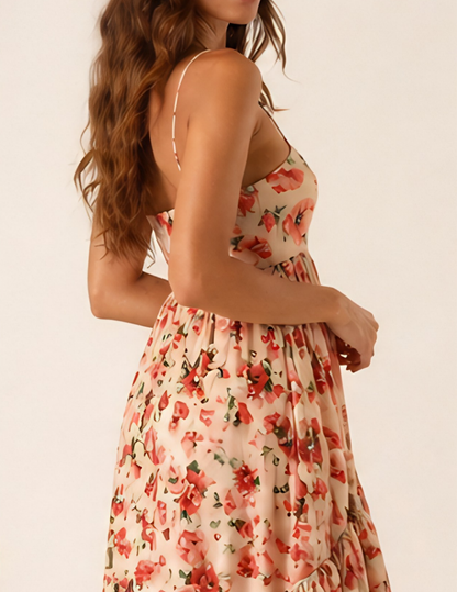 Woman wearing a floral dress with a plain background
