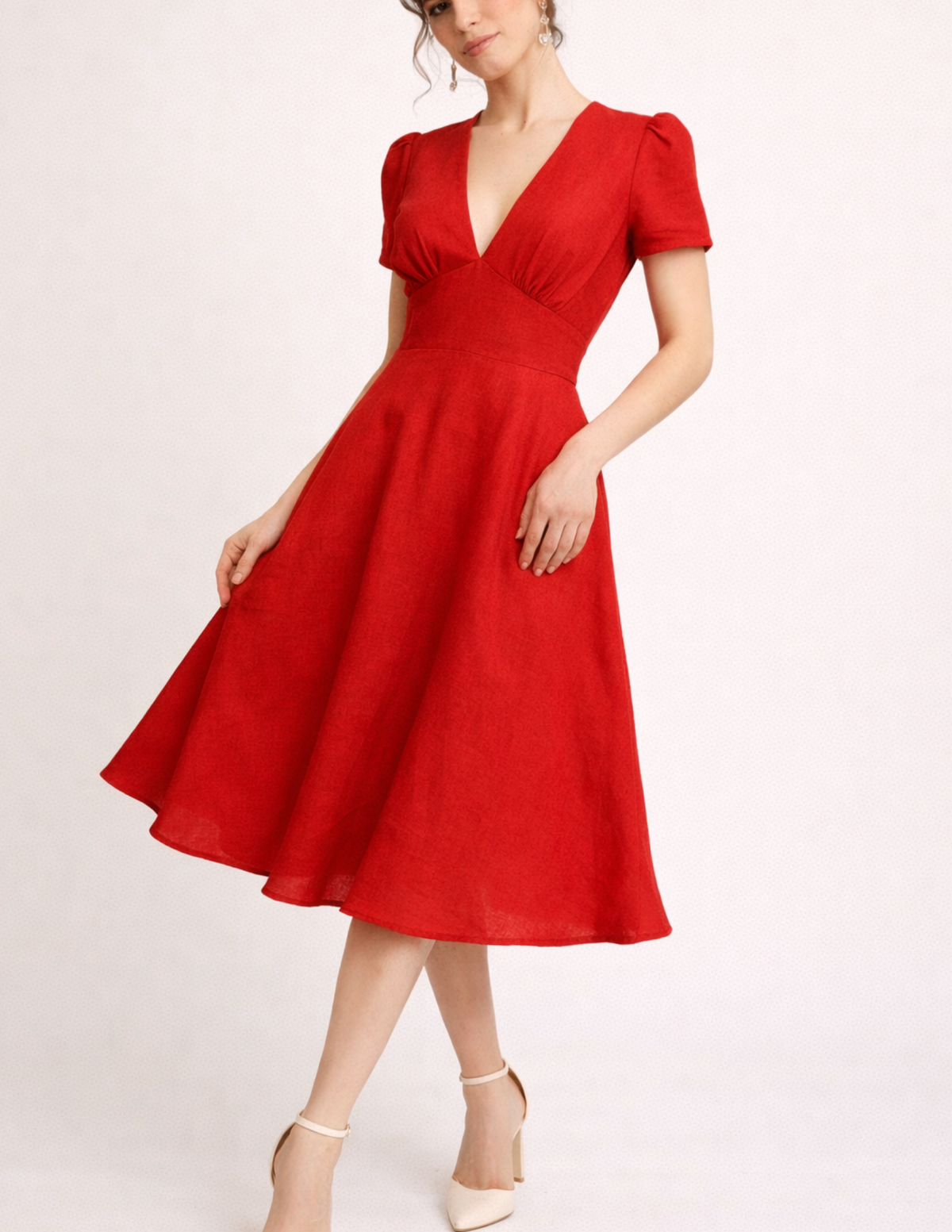 FAYA women's dress sewing pattern front and back illustration showing the fitted bodice, puff sleeves, defined waist and full flared skirt.