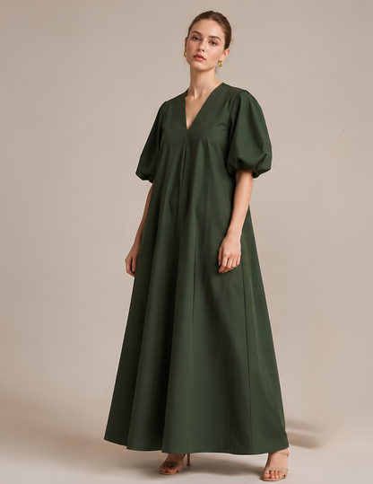 Full front view of the IRIS loose fit maxi dress made from the PDF sewing pattern featuring a V-neck, puff sleeves and flowing silhouette