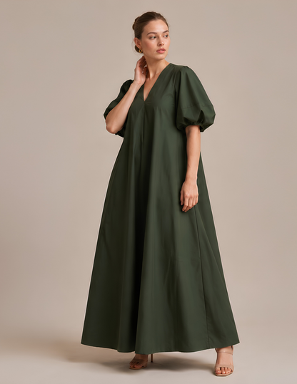 Three-quarter front view of the IRIS women's maxi dress sewing pattern with elegant loose silhouette and puff sleeves