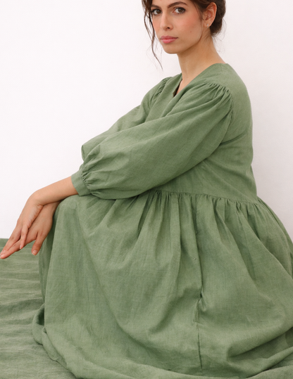 MIMA dress sewing pattern shown from the side, highlighting the relaxed fit, gathered waist and full midi skirt