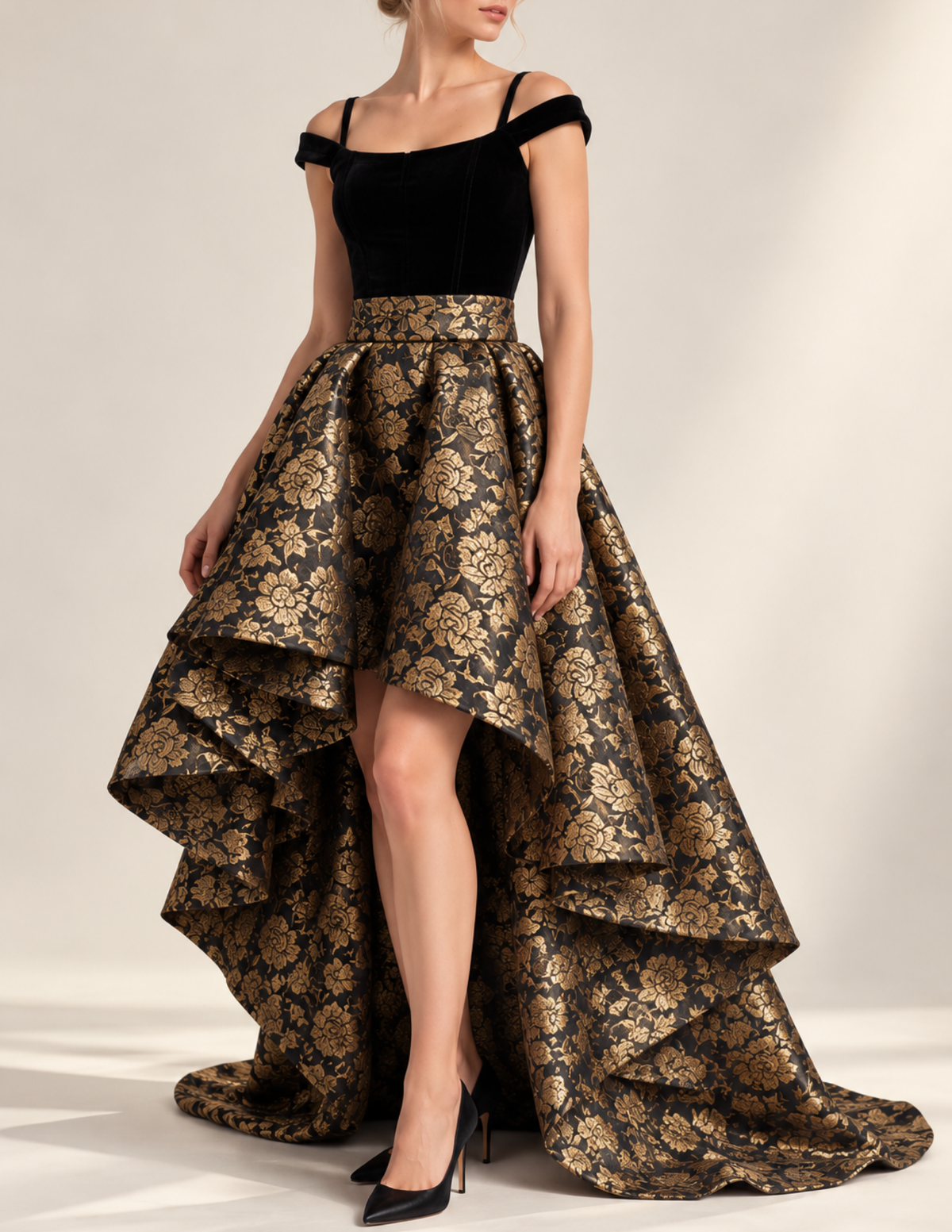 Close-up of the ODETTE high-waisted circle skirt in black and gold fl oral brocade, highlighting the gathered waist, voluminous fabric, and asymmetrical hem.