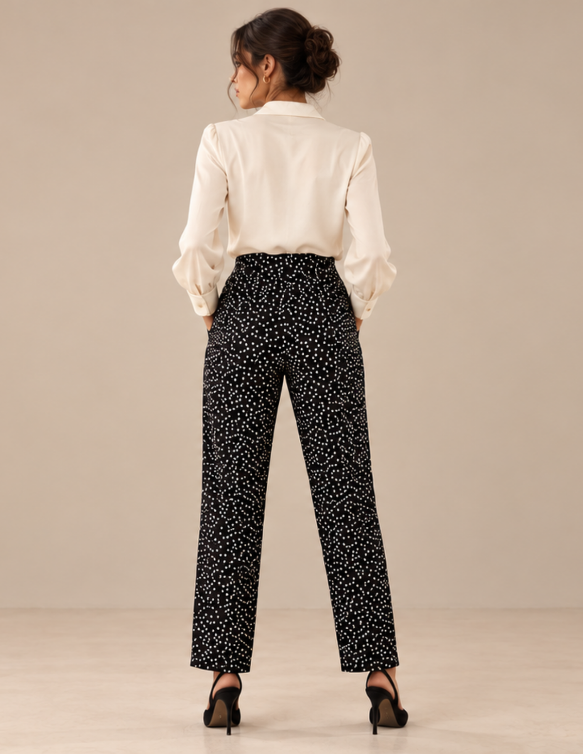 Back view of the Suri women's 
trousers, highlighting the high waist, 
fitted waistband area and straight
leg cut of the digital sewing pattern.