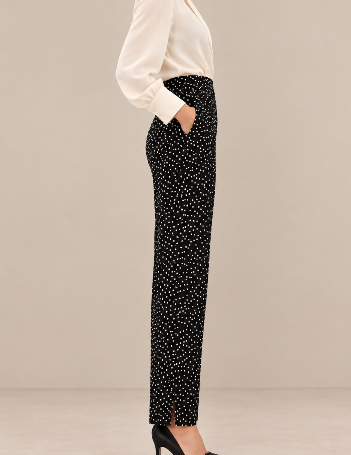 Side view of Suri high-waisted 
women's pants showing the slanted 
side pocket, smooth waistline and 
straight tapered trouser leg.
