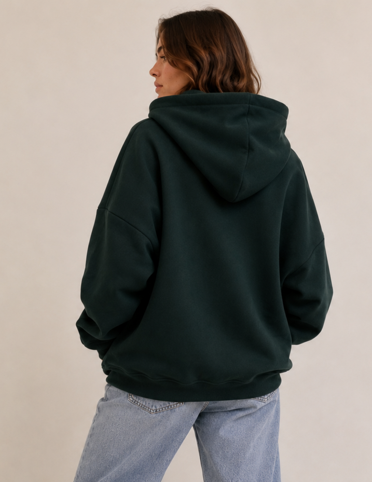 Back view of the VERNA women's 
hoodie showing the hood, dropped 
shoulders, long sleeves, lower hem 
band, and relaxed pullover 
silhouette